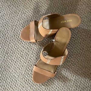 Tan wedge sandals.